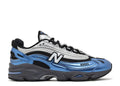 Blue and black New Balance 1000 Metallic Blue trainers with ABZORB sole and silver accents sneaker with New Balance logo on a white background