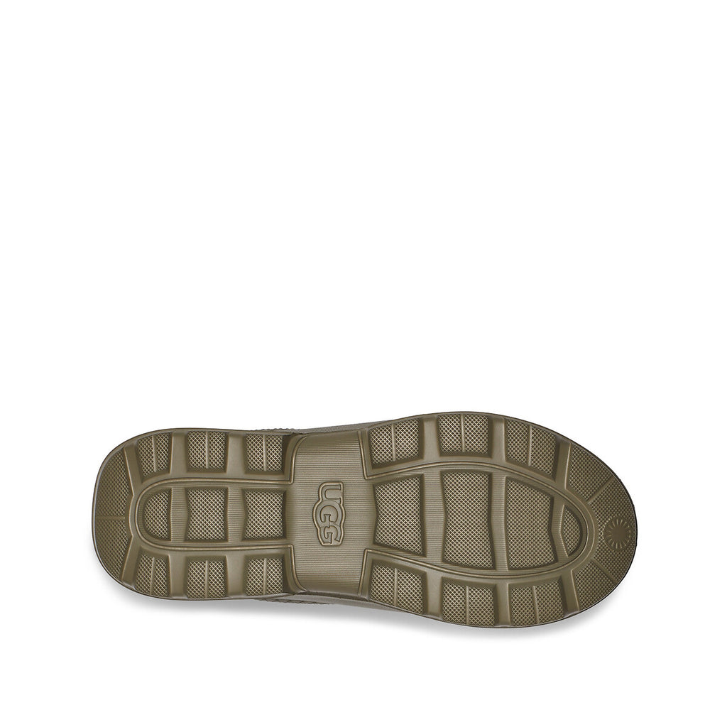 Brown sole of UGG Women's Tasman Clogs in Chestnut suede with embroidered braid detail shoe on a white background