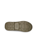 Brown sole of UGG Women's Tasman Clogs in Chestnut suede with embroidered braid detail shoe on a white background